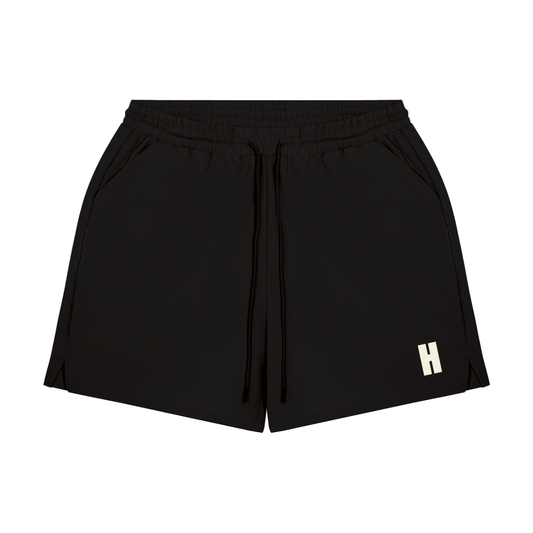 The Threshold Short - lightweight performance running shorts with the Headwinds H above the left hem