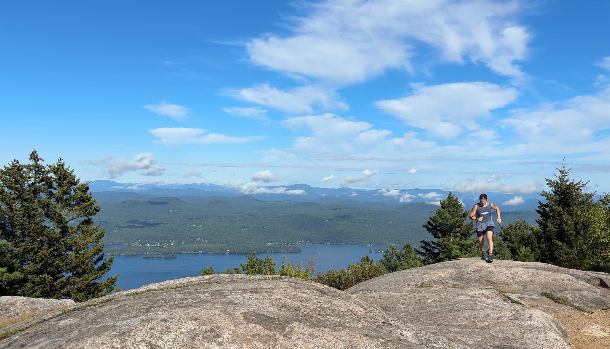 Runner on the Buck Mountain summit above Lake George in the Vert Tank