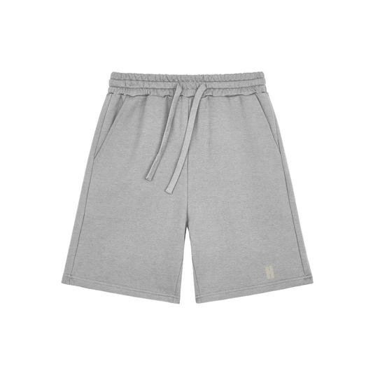 The Cooldown Short — heavyweight cotton sweat short with the H monogram on the left leg